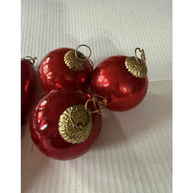 This lot of 8 vintage Christmas ornaments features a kugel style design with hearts, balls, and teardrop shapes, all in a...