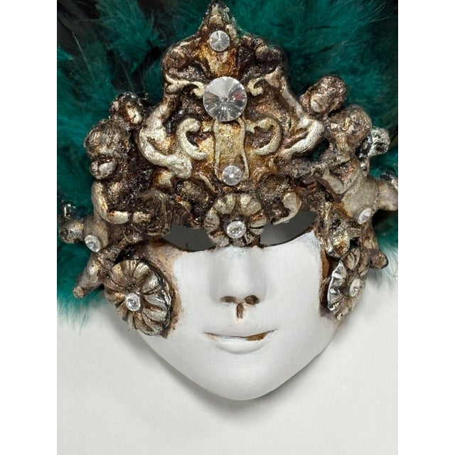 This ceramic mask was handmade by the Artisans of Casin dei Nobili, one of Venice's most prestigious Mask Makers. Made...