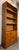 Danish teak veneer bookcase / storage cabinet with six levels of adjustable shelving, two of which are concealed behind...