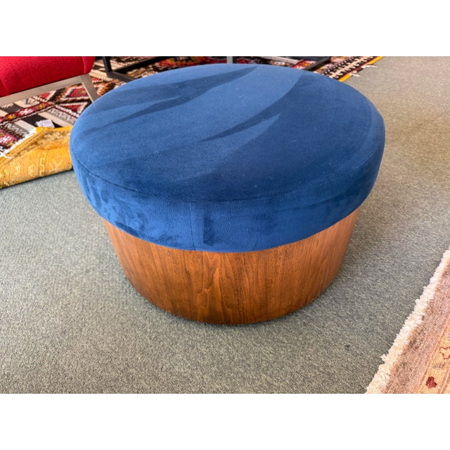 Design Plus Gallery presents a Sapphire Blue Storage Ottoman from West Elm. The sleek, drum shaped silhouette transitions...