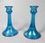 Vintage iridescent blue glass trumpet shape candle holders. Unmarked, holds a .75" candle, some surface scratches to base.