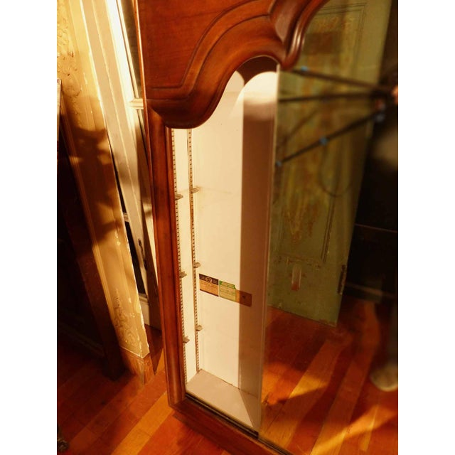 Mid century custom made oversize medicine cabinet in a traditional French design. Walnut frame cladding a steel cabinet...
