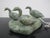 Canadian Inuit soapstone sculpture by Kawavow King, Frobisher Bay. 3 Green soapstone geese set upon a base. Each goose has...