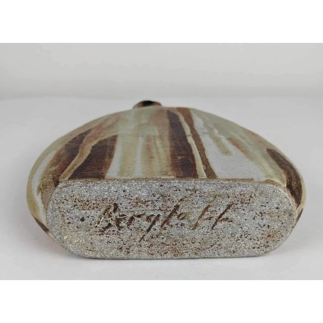 Andrew Bergloff (1929-2015) signed mid century modern studio pottery Paddle vase. Bergloff was a ceramicist active in the...