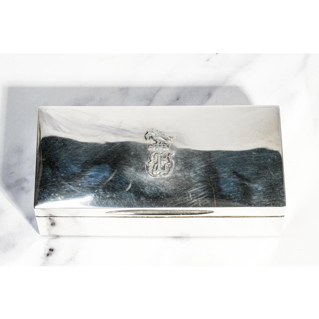 A striking and deeply personal piece of Victorian craftsmanship, this 1885 English sterling silver cigarette box embodies...