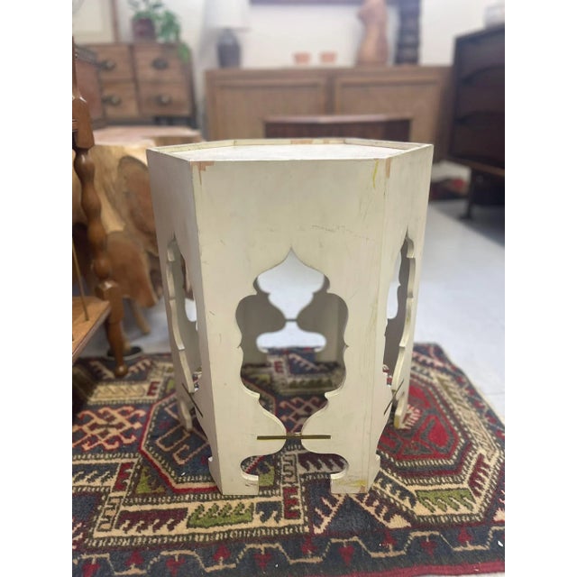 Accent Table with Unique Wood Carvings. Metal Inserts on each Side. Vintage Condition Consistent with Age as Pictured....