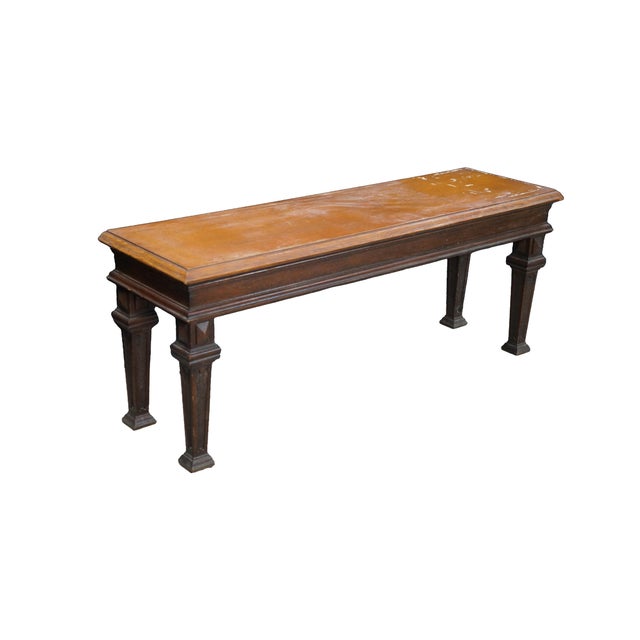 Antique Victorian English Tudor hall bench / seat / stool. Made of oak featuring rectangular form with four distinctively...