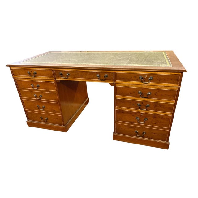 Large executive desk, crafted in the Georgian Revival style, offers elegance and functionality for a professional or home...