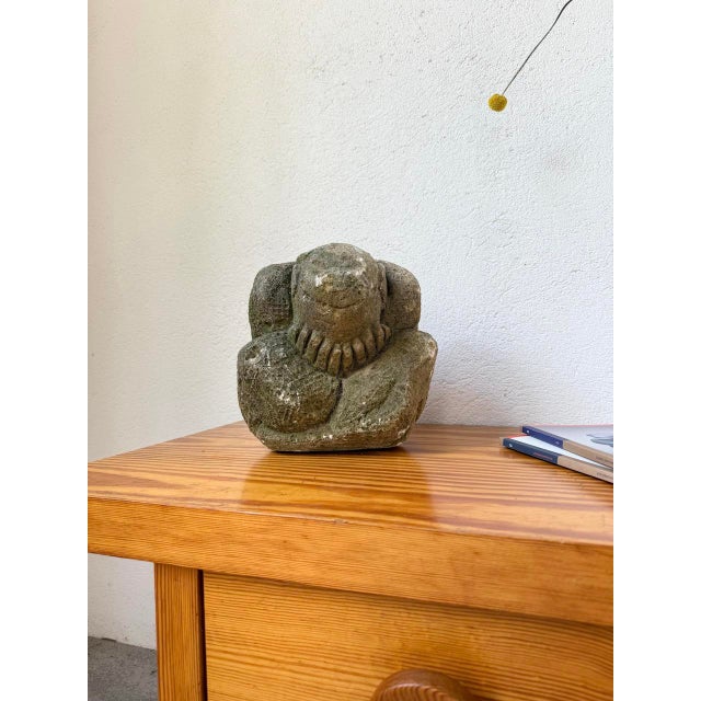 Stone sculpture depicting a hunched man with his hands over his face. Very good condition, beautiful original patina....