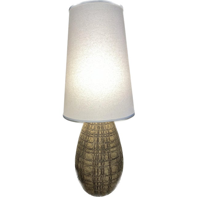 Ceramic lamp with a sgraffito design, with shade: 14.5”w x 38” (base 11”w). Rewired.