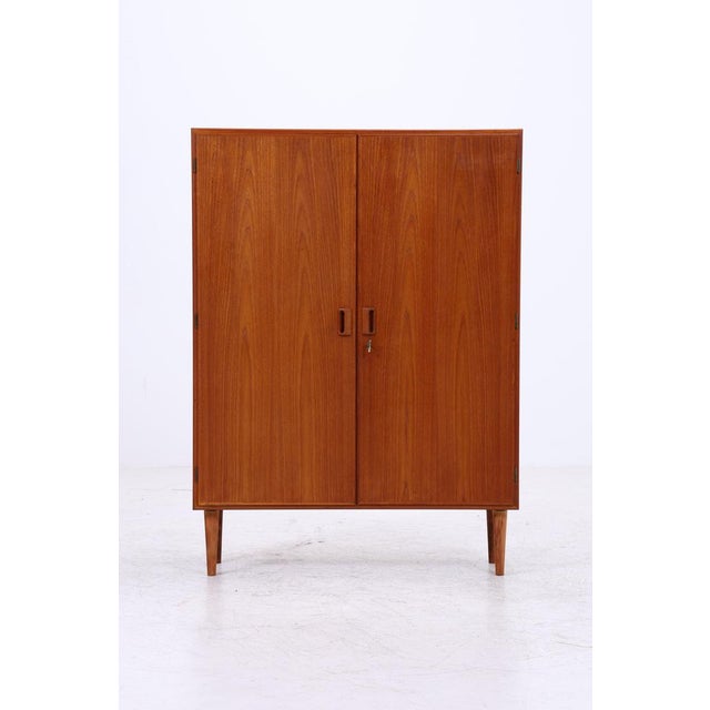 Vintage linen cupboard designed by Børge Mogensen. The warm teak wood, understated handles, and clean lines are exemplary...