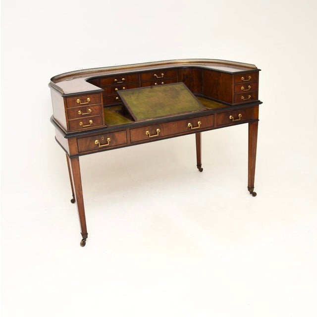 A magnificent antique leather top Carlton House desk. This was made in England, it dates from around the 1890-1900 period....