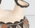 An Acoma Pueblo pottery wedding vase by the ceramicists Louis and Nadine Mansfield. This vase features a rounded body and...