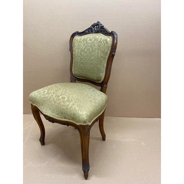 Beautifully carved daisy, scroll and lattice Rococo revival side chairs. Set of 4.