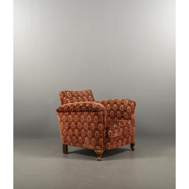 timeless elegance a masterpiece from the 1920s. This armchair combines the defining characteristics of Art Deco with solid...