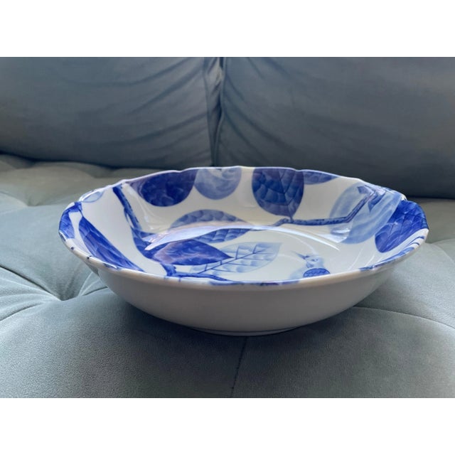 This Blue and White Bowl features an Exotic Bird hiding in Persimmon Tree. It is about 10 in in diameter and 2.5 in deep