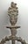 Bronze decorative furniture applique with a wreath and torch motif. Good condition with appropriate wear from age. One...