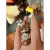 Curated collection of eight vintage-style mini charm and statement rings in mixed-metal finishes, featuring signet...