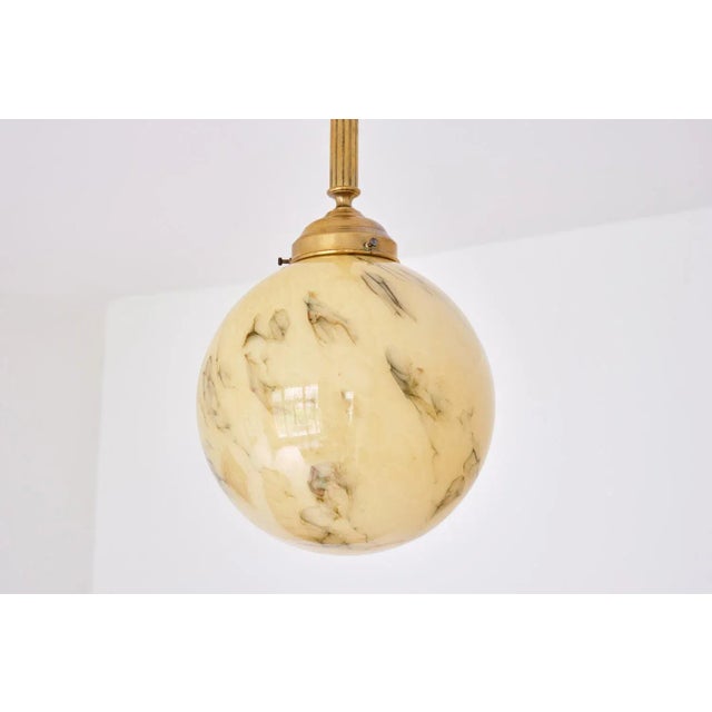 This striking pendant light was produced in the Netherlands in the late 1940s. The lamp on offer here was installed in the...