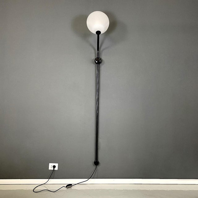Italian modern sconce Parter by Achille Castiglioni for Flos, 1970s Wall sconce mod. Parter. The structure is in gunmetal...