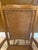 Oak rocking chair with a hand-woven splint herringbone seat and basket-weave back with wrapped rails. Wide paddle arms and...
