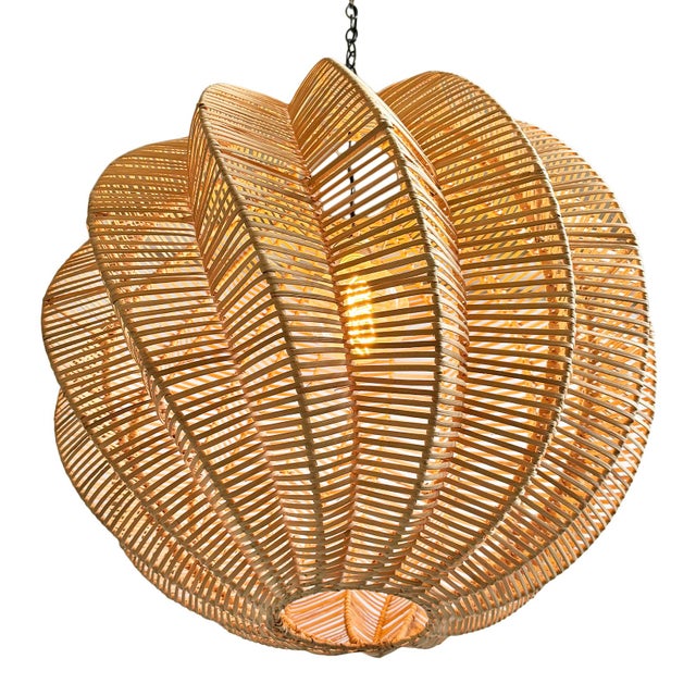 Hand woven raw wicker globe pendant light with unique spiraling dimensional design. Each may vary slightly in natural...