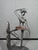 A striking vintage metal bookend featuring an abstract ballerina or dancer rendered in an expressive Brutalist / Modernist...
