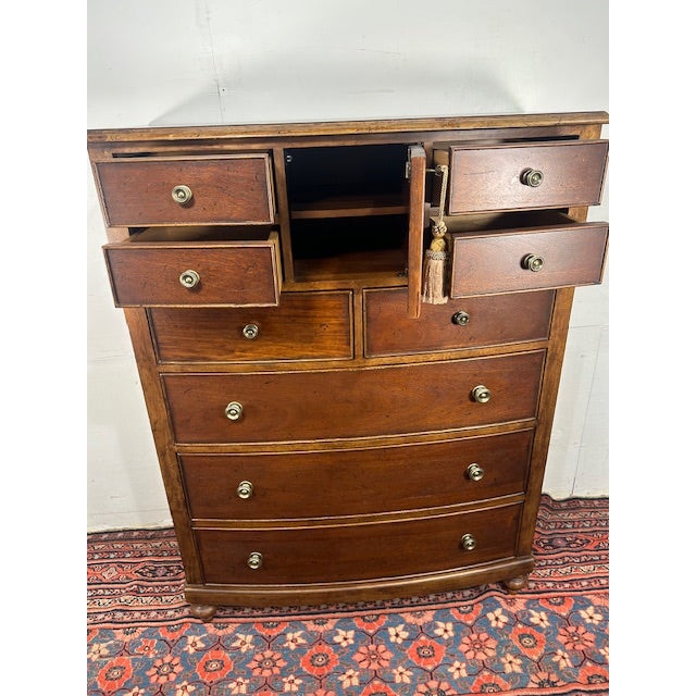 This Universal Furniture Tallboy Dresser with Lock carries a sense of quiet confidence that instantly grounds a bedroom....