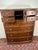 This Universal Furniture Tallboy Dresser with Lock carries a sense of quiet confidence that instantly grounds a bedroom....