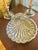 This silver plate shell shaped dish has an image of Neptune in a very Rococo styled crest with shell and wave motifs. Most...