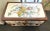 Vintage 1900's Hand Painted Floral Steamer Trunk, painted in a floral pattern on a white base coat. Bottom and back not...
