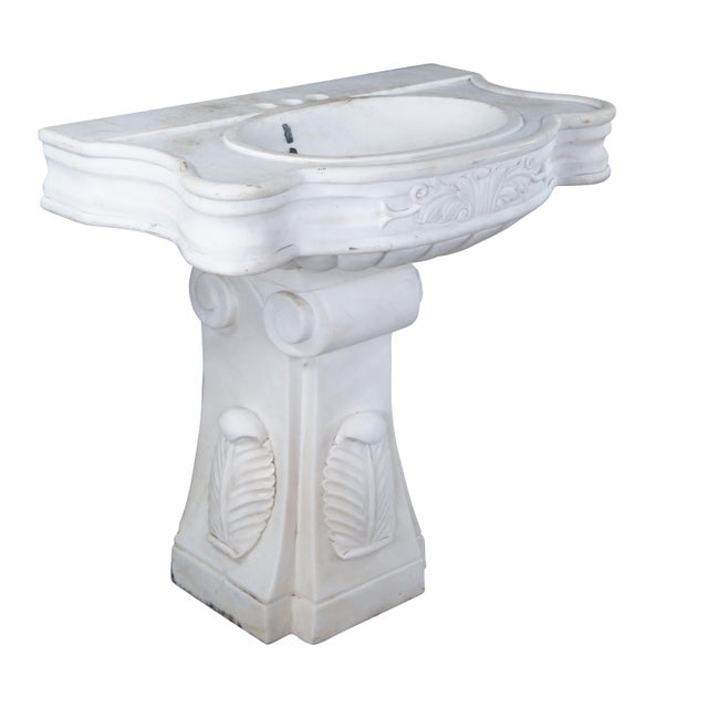 Monumental mid century Italian Neoclassical white Carrara marble bathroom sink. A thick rectangular plinth column supports...