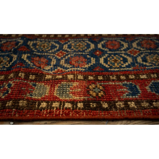 "This is a vintage Chinese Khotan wool carpet, dating back to circa 1935. Measuring approximately 6 by 11.5 feet, the rug...