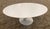 This Eero Saarinen Tulip Coffee Table features a white laminate top with a beveled edge that was made in Italy. The base...