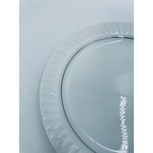 A dinner plate by the renowned Thomas Germany manufacturer, part of the prestigious Rosenthal Group, from the 1960s and...