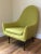 A classic Paul McCobb high back chair. Unusual shape, newly reupholstered in natural wool, chartreuse.