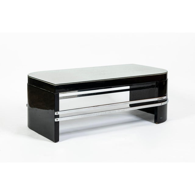 This distinctive vintage black lacquered Art Deco coffee table was produced circa 1935 and is reflective of luxury French...