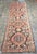 A richly patterned antique Karabagh runner, this substantial 16-foot-long carpet combines the strong geometry of Caucasian...