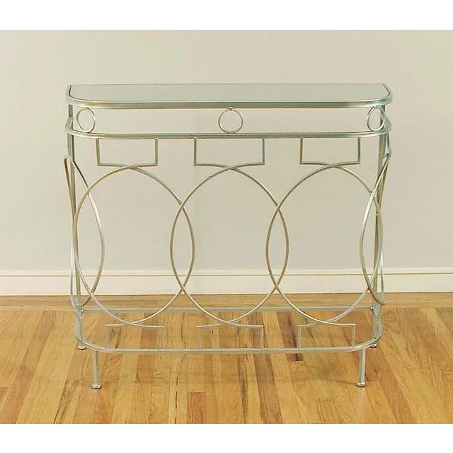 Offering a very stylish mirror-topped console table, of newish creation (I don't think it's very old). No indication of...