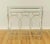 Offering a very stylish mirror-topped console table, of newish creation (I don't think it's very old). No indication of...