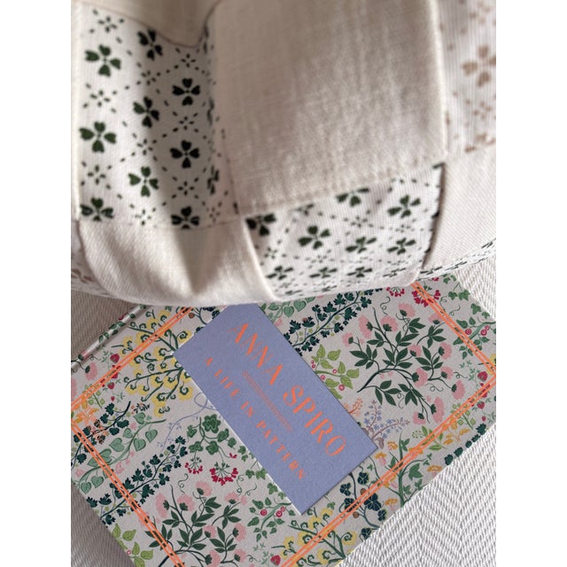 A delicate botanical print in dark green and taupe brings a painterly, collected feel to this lumbar pillow. Finished with...