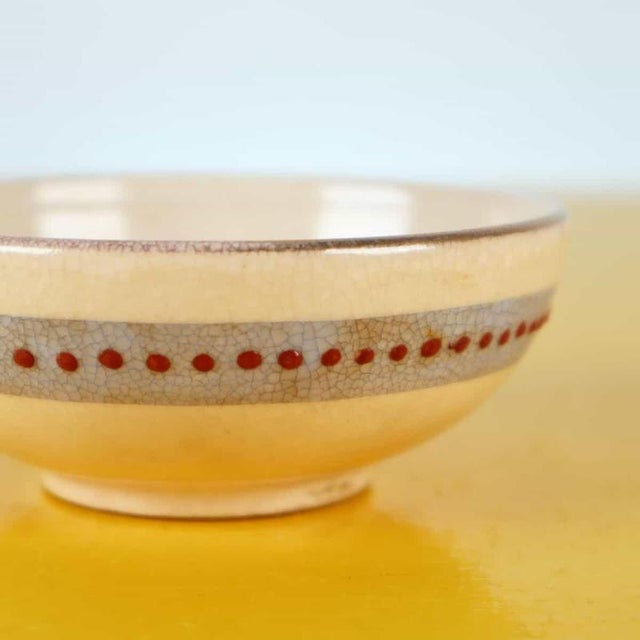English: item : this elegant bowl is a charming example of oriental handcrafted ceramics, featuring a delicate floral...