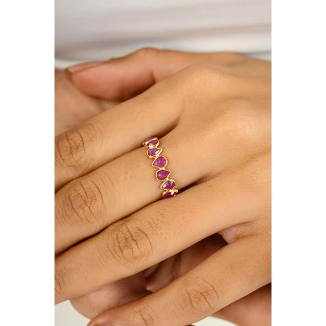 Handmade 18k Yellow Gold Pear Cut Natural Ruby Stackable Eternity Band Ring symbolizes the everlasting love between a...