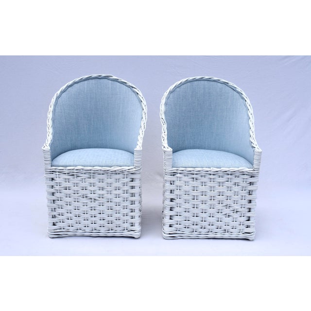A very sweet pair of vintage Wicker Works white lacquered mid size chairs newly upholstered in sky blue cotton. 1980's...