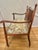 This antique Sheraton Revival settee dates to circa 1890–1905, featuring an unusually graceful spindle back, carved...