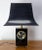 Black and golden table lamp black lacquered wood. Decor of butterflies flying on plants. French circa 1970. This can be...