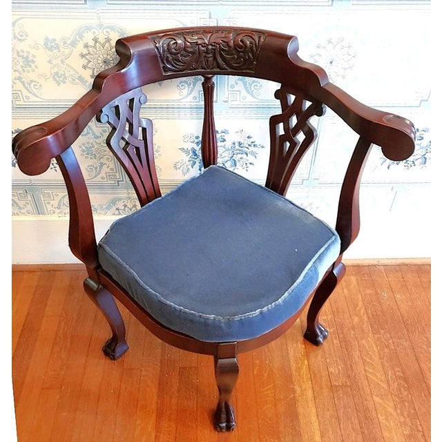 Late 19th-century English Victorian Gothic Revival mahogany corner chair featuring a hand-carved Green Man foliate mask,...