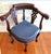 Late 19th-century English Victorian Gothic Revival mahogany corner chair featuring a hand-carved Green Man foliate mask,...
