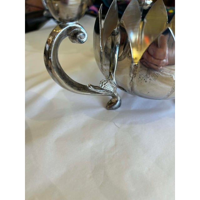 Lovely pair of 3 arm, silver plate candleabras with large center vessel to hold a pillar candle or flowers. Tiny grape...