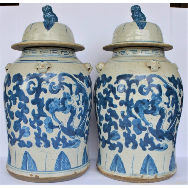 This is a pair of large, high quality porcelain blue and white Balaster Temple Jar / Ginger Jar decorated with a leaf and...